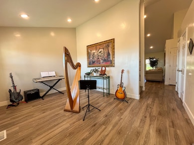 Living area with recessed lighting and wood finished floors