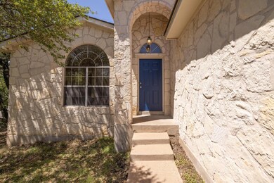 View of exterior entry with stone siding