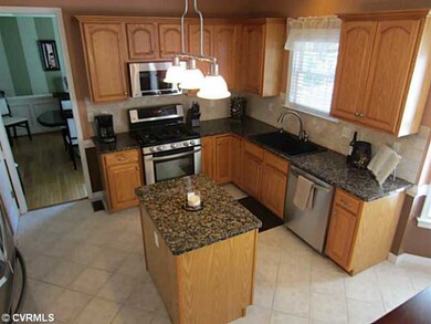 Kitchen - Kitchen Boasts Granite Counters and Diamond Laid Tile Backsplash and Flooring. All Stainless Steel Appliances including Built-in Microwave and Refrigerator will convey with sale.