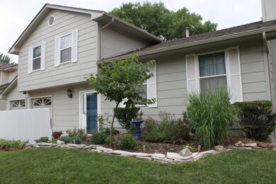 Darling curb appeal with shutters & courtyard pati