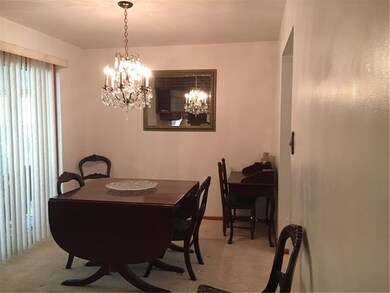 Dining room opens to the 3 season's room...