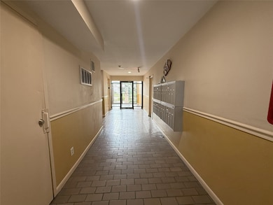 This photo shows a clean, well-lit hallway with ma