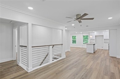 Unfurnished living room with ceiling fan, light wood-style floors, recessed lighting, and crown molding