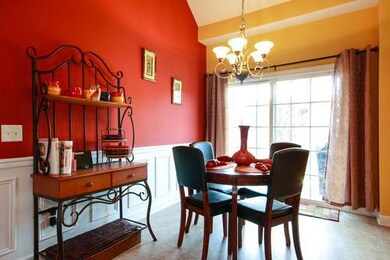 Eat-in Kitchen Opens to Covered Patio; Wainscoting.