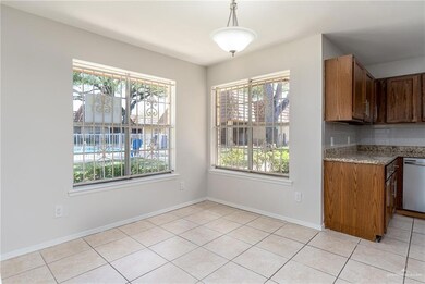 Spare room featuring plenty of natural light, a ceiling fan, recessed lighting, light tile patterned flooring, and baseboards