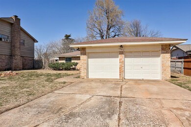 Detached garage featuring fence