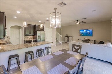 Dining space featuring light tile patterned floors