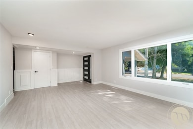 Living room with front door entry