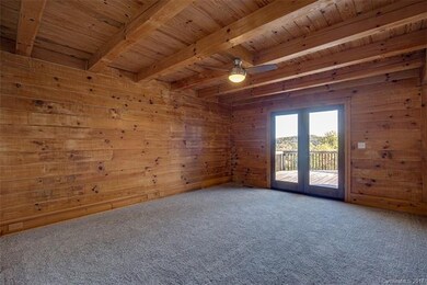 master bedroom with new carpet and french doors to