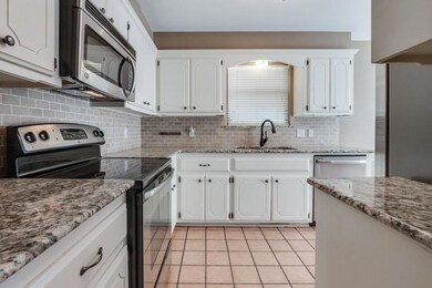 Kitchen featuring appliances with stainless steel 
