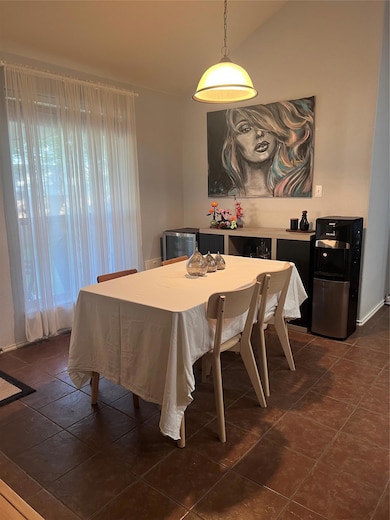 Dining room featuring healthy amount of natural l