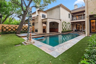 Step out into this backyard oasis with a stunning