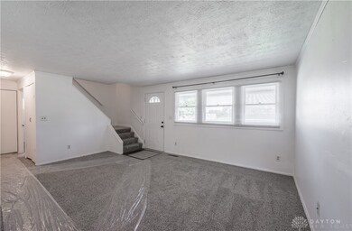 Large living room w/ NEW carpet &  a lot of natural light