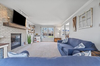 This spacious family room features a beautiful raised brick fireplace that is sure to be a favorite gathering place.