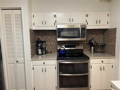 Attractive tile backsplash adds to the charm of th