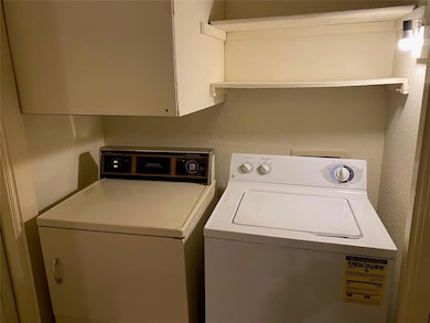 Laundry area with washer and clothes dryer and la
