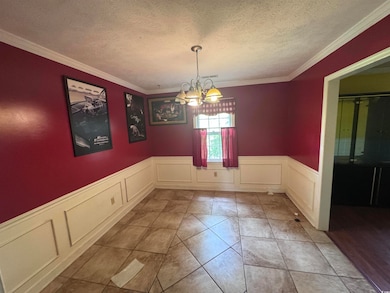 Unfurnished dining area with a decorative wall, a 