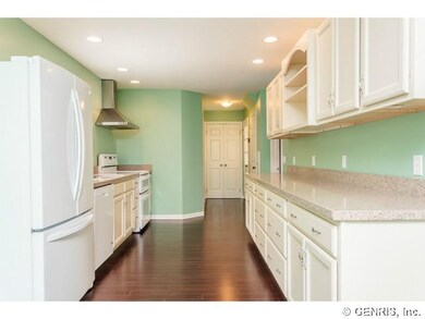 Kitchen. Real wood cabinetry, bamboo floors, quart