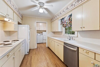 Kitchen with ornamental molding, washing machine a
