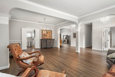 Spacious open-concept living room filled with natu