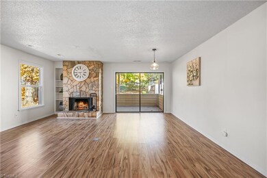 Spacious open-concept living room complete with outlets built into the floor.