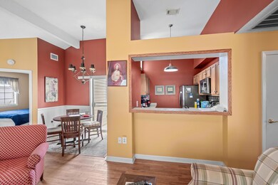 Interior space featuring a chandelier, beam ceilin