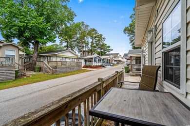 Wooden terrace featuring a residential view