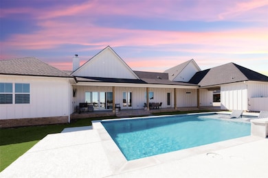 Pool with a patio and french doors