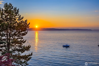 Here is one of the views you will become accustomed to living here. Across the way Vashon Island and the Olympics profiling in the horizon. Note that the Range is not showing here hidden behind a mystery of clouds.