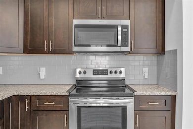 Kitchen featuring appliances with stainless steel