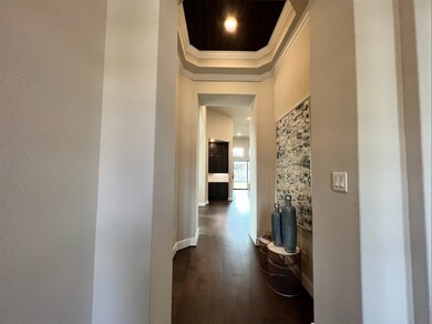 Welcome to 14811 Kingsford Willow Lane! Gorgeous hardwood floors throughout the home! Entry has wood feature ceiling w/crown molding adding a special touch.