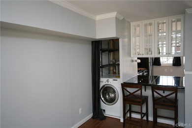 Kitchen pass through with bar seating and Laundry