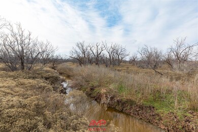 Wet weather creek bed runs through property - more