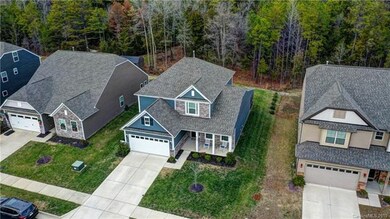 Home/rear yard backs up to 50' treed buffer.