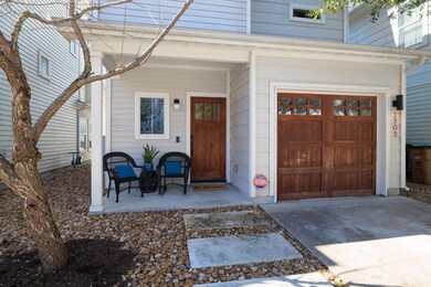 Entrance to property with concrete driveway, a po