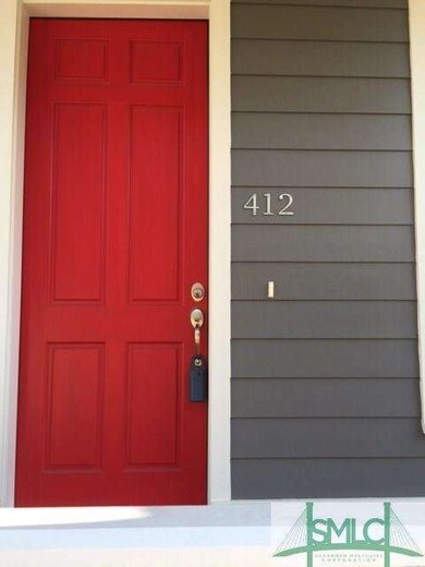 412 E 32nd St Red Door