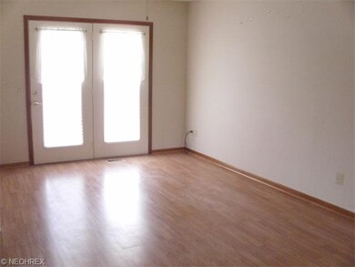 The dining room leads to a deck for summer fun and