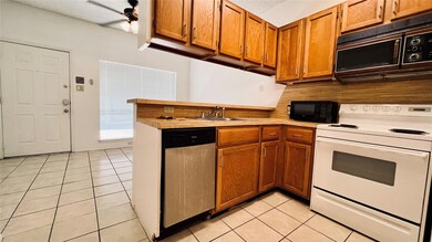 Kitchen with a sink, white range with electric st