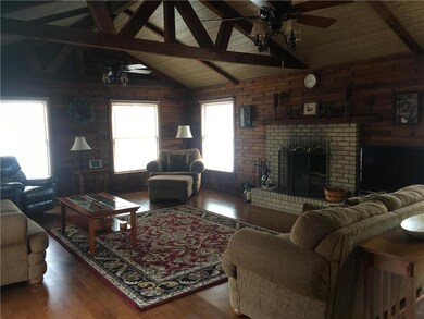 View of Great Room, wood flooring, beams and solid