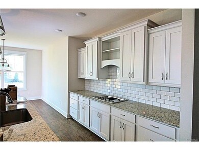 Custom cabinets in the kitchen and tile backsplash