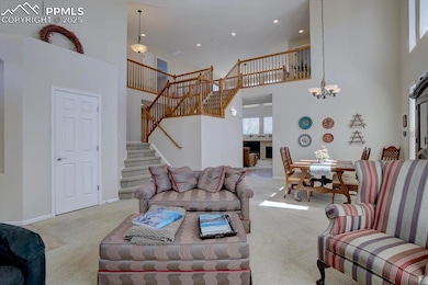 Carpeted living room featuring a chandelier, a high ceiling, stairs, baseboards, and recessed lighting
