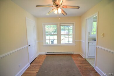 Separate dining room with chair rails