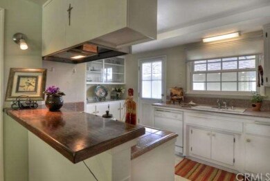 Kitchen with breakfast bar and built-in china cabi