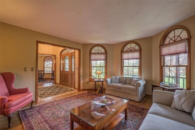 LIVING ROOM HAS HARDWOOD FLOORS AND PLENTY OF LIGH