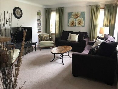 Living room has tons of natural light and plenty of room to entertain.
