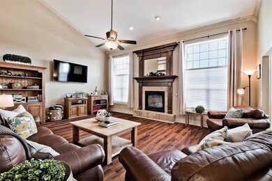 This Oversized Living Room with Two Story Ceilings & Ample Light pouring through the Floor-to-Ceiling Windows Makes this the Perfect Space for both Formal and Casual Gatherings...