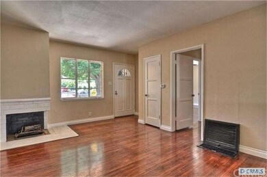 cozy living room with real wood burning fireplace