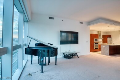 Sitting room featuring light carpet