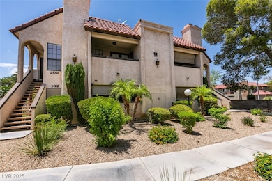 View of property with stairs