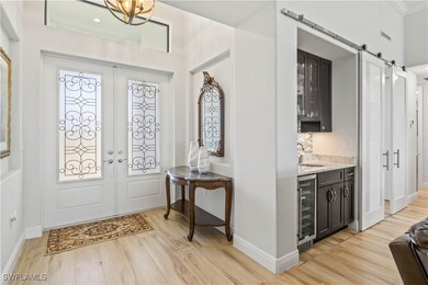 Double door entry with transom window and soaring